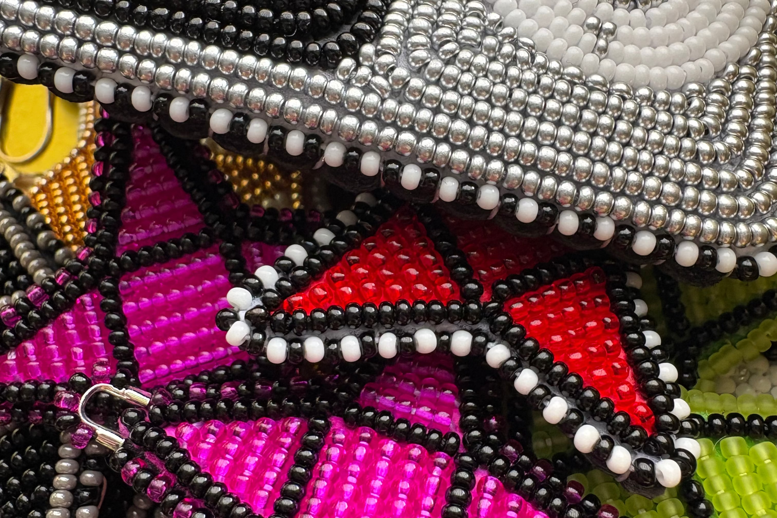 Close-up of a colorful beaded jewelry with geometric patterns